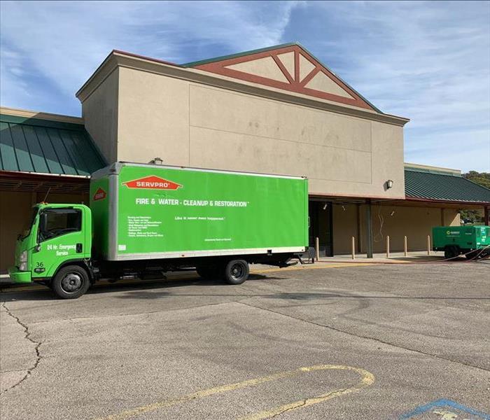 SERVPRO truck parked outside commercial property.