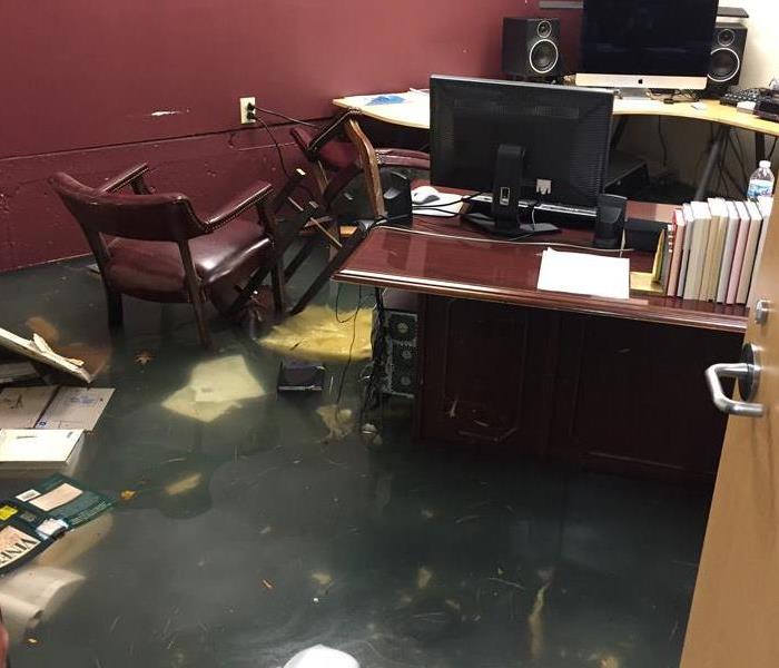 Office with a foot of standing water from flooding